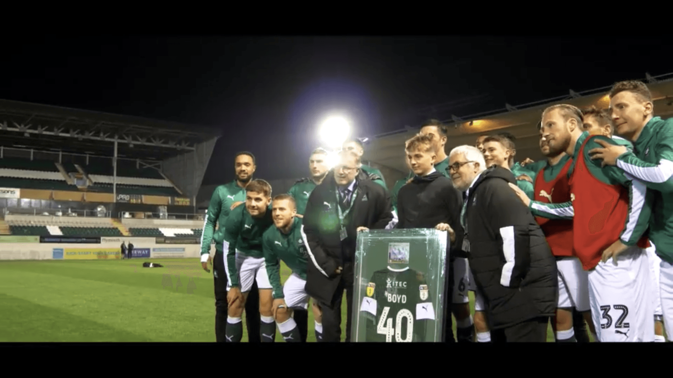 Jude Boyd presented with his framed Plymouth Argyle debut shirt #40 BOYD by the first team