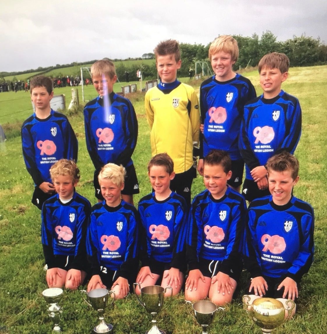 Jude Boyd's youth team with trophies in England